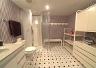 Basement Bathroom  Large 3pc washroom with changeroom hooks and bench for pool.