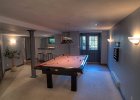 Games Room  Large games room with pool table and walk-up to yard.